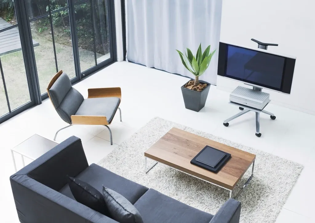 A bright open-plan living space with full-height glazing onto a garden