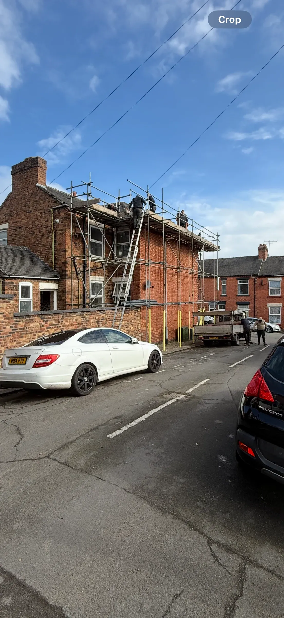 The terrace from the street with scaffolding erected to the front elevation